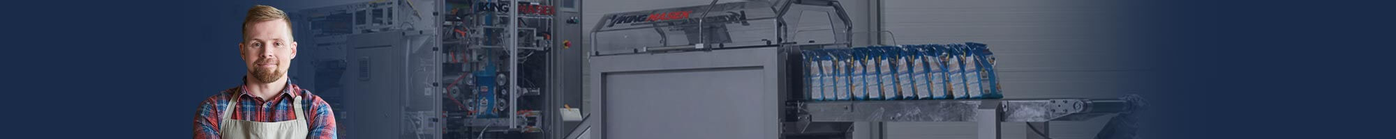 Man in Apron in front of machine
